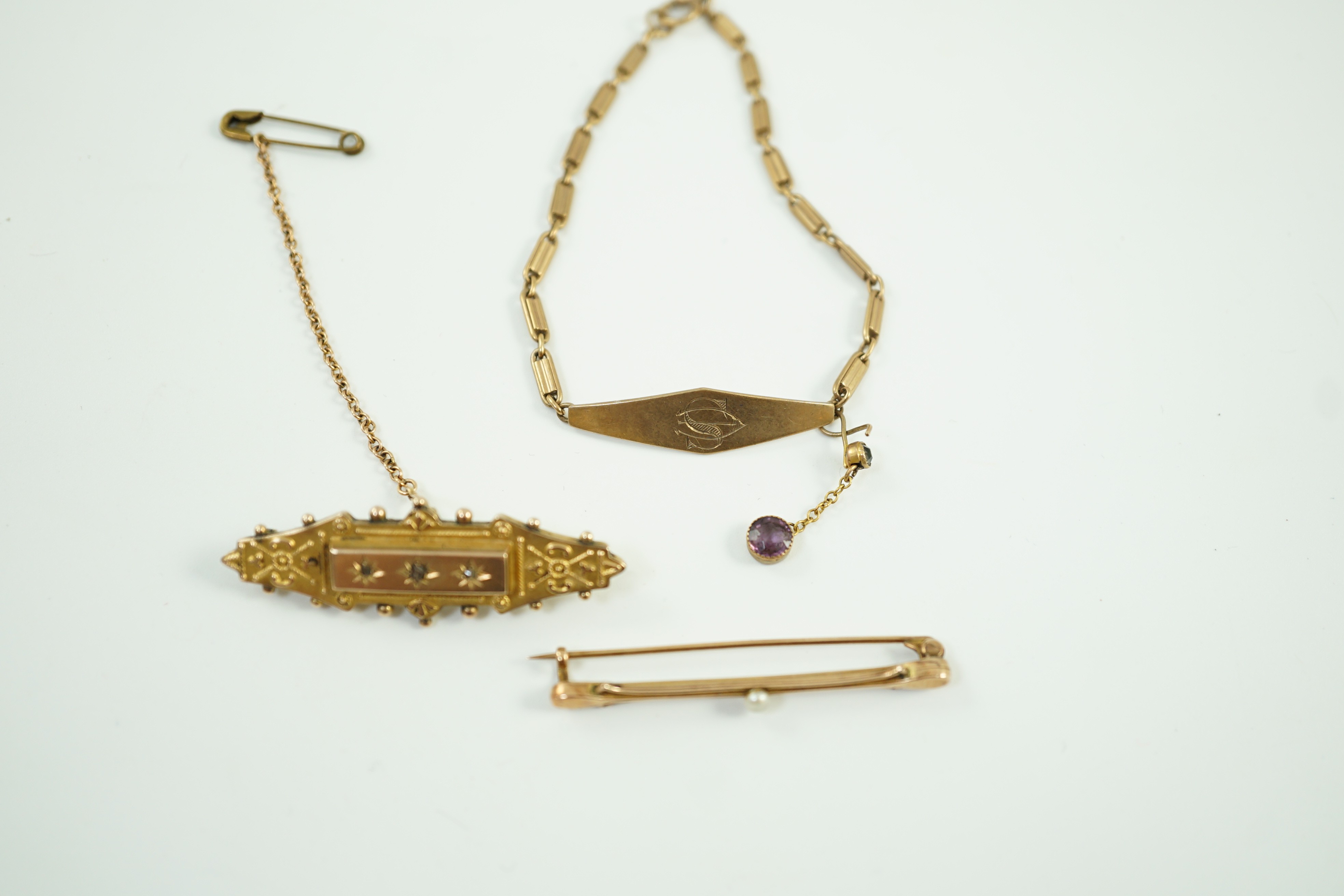 Two early 20th century yellow metal brooches including 9ct and diamond chip set and a seed pearl set bar brooch by Murrle Bennett & Co?, together with a 9ct identity bracelet, gross weight 10.6 grams.